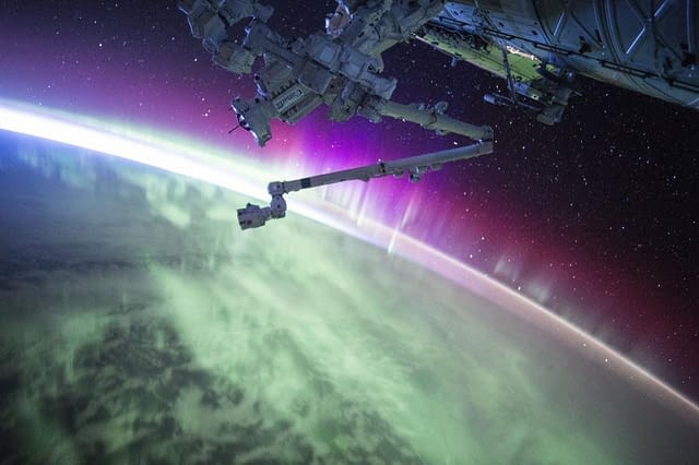 An Aurora traveling above the Earth, seen from the International Space 